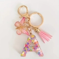 Pink resin alphabet A keychain with glitter sequins, butterfly pendant and fringe tassel - Letter A