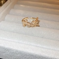 Adjustable gold letter logo ring with pavé pavé cubic zirconia on velvet background - Gold Letter Logo Pave Zircon