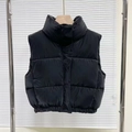 Women's minimalist black padded vest with a stand collar and high-gloss quilted finish - XS / Black