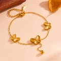 Detail of gold stainless steel butterfly necklace showing S-STEEL engraved charm - Gold Butterfly Bracelet