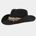Close-up of black straw sun hat featuring ethnic woven band with shell and starfish charms - Black