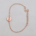 Rose gold chain bracelet featuring a circular hollow letter D pendant and lobster clasp - Rose Gold D