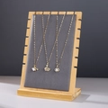 Bamboo jewelry stand with grey flocking displaying multiple golden pendant necklaces - ZM009 Medium Grey Velvet
