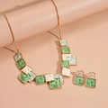 Detail of gold geometric square necklace and earrings set with green and white enamel - Green 2-Piece Set