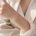 Elegante bracciale a catena serpente dorata con chiusura regolabile e piccole perline tonde - Bracciale / Oro