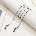 Detail of black beaded metal chain with lobster clasps and anti-slip rubber loops - Gun Black