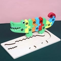Colorful crocodile wooden puzzle for kids with numbers 1 to 10 on a wood base board - Crocodile