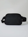 Detail of waterproof black nylon waist bag featuring zip closure and adjustable buckle strap - Black