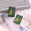 Detail of dark green Christmas gift tags with gold Merry Christmas print and tree motif - Green No.5 (Christmas Tree Pattern)