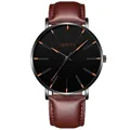Detail of classic quartz watch with brown leather strap and orange markers on black dial - Leather Strap Brown Band Black Case Rose Gold Hands