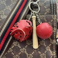 Close-up of mini red leather baseball glove, wooden bat and ball keychain charm on bag - 3.5CM Red/Black Strap