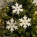 Set of 3 white snowflake Christmas ornaments with glitter finish on festive tree - Snowflake Style 2