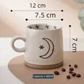 Cream stoneware 400ml coffee mug with hand-painted black moon and stars pattern - Large Moon Mug