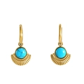 Bohemian gold hoop earrings featuring turquoise pendants with sunburst metal accents - Gold