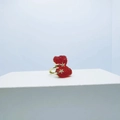 Golden crystal bear ring with red textured bear and stars on a white stand - Ring / Red