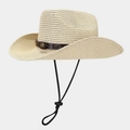 Detail of woven straw cowboy hat featuring brown leather band and metallic buckle accent - Beige