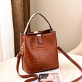 Chic brown crocodile pattern bucket bag with golden hardware and adjustable strap - Earthy Yellow