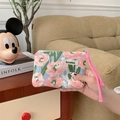 Detail of pink floral canvas makeup bag held by hand in a cozy lifestyle setting - Pink Hibiscus