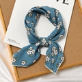 Navy blue cotton linen scarf with small white floral pattern tied in a knot - Osmanthus Blue Base