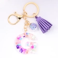 Letter G crystal resin keychain with purple glitter, tassel, and gold lobster clasp - Letter G
