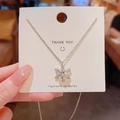 Silver snowflake pendant necklace with cubic zirconia stones on a display card - 28# Xl1374-1 Cross Chain Rotatable Snowflake