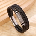Dettaglio degli strati in pelle nera intrecciata e chiusura magnetica in metallo argento - Nero