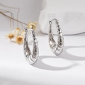 Polished silver-plated copper croissant hoop earrings with a sleek minimalist design - Silver