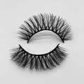 Close-up of dense curled black faux mink eyelashes with thick band on white background - D132N