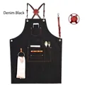 Durable black denim work apron with brown leather cross-back straps and utility pockets - New Leather Strap Black Denim with Metal Loop