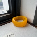 Minimalist wide yellow resin bangle featuring a semi-transparent marble design - Yellow