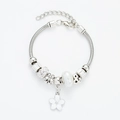 Silver snake chain charm bracelet with white flower pendant and pearl beads on white background - White Floral Bracelet