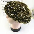 Fashionable black velvet beret with shiny gold sequins for women in a side view - Gold