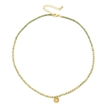 Detail of bohemian gold beaded necklace with green accents and textured round pendant - Grass Green