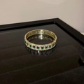 Macro view of gold flower bracelet with emerald-colored gems and white zircon inlay - Green Rectangle Gold Trim Bangle (9#)