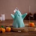 Blue ghost scented candle for Halloween decor on wood base with 9cm height and 8cm width - Chubby Lake Green (Blackberry & Basil)