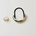 Close-up of golden crescent hair tie and crossover pavé ring on a clean white surface - 13# Thick Version Arc Gold