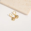 Macro shot of gold tree of life earrings with multicolored zircons on beige stone - Multicolor Zirconia Tree Of Life (ES2638-1)