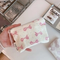 Detail of floral cotton coin purse with pink bow print and branded fabric label - Light Blue Polka Dot Pink Bow