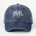 Unisex washed blue denim baseball cap featuring white gigi heart embroidery on front - Navy Blue