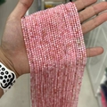 Pink quartz round faceted beads strands held in hand for jewelry making and DIY crafts - Grade A Peru Pink Opal 3mm