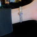 Silver vintage flower bracelet with square-cut white crystals worn on wrist - Silver Flower Double Layer