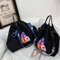 Detail of black nylon tote with 'Embrace Yourself' embroidery and woven rope handles - Black Embrace Yourself (Without Shoulder Strap)