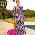 Detail of high-slit floral maxi dress featuring a deep V-neck and tropical leaf print - S / Dresses / Colorful