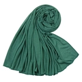 Close-up of dark green jersey headscarf with fine stitching and soft fabric texture - Green