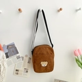 Brown corduroy crossbody bag featuring a cute teddy bear embroidery and adjustable strap - Brown