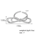 Minimalist silver ribbon bow ring in polished copper with adjustable open design - US 7 / Steel