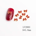 Red and gold bow nail art charms LF2003 with rhinestones on red manicure surface - LF2003 Gold Red Rhinestone Bowknot