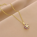 Elegant gold flower necklace with purple cubic zirconia petals on silk background - Gold-Purple Zirconia