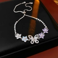 Detail of silver bracelet featuring zircon flower and butterfly charms with sliding clasp - Silver-Purple