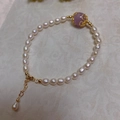 Detailed macro view of baroque pearl bracelet with purple bead in gold filigree setting - Pearl With Lavender Quartz Style (SL7-6)